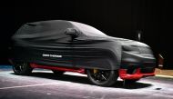 A picture taken on March 5, 2018 in Geneva shows a covered Jeep Grand Cherokee model car ahead of the start of the Geneva International Motor Show 2018.  AFP / Harold Cunningham

