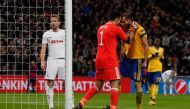 Juventus' Italian defender Giorgio Chiellini (R) reacts with Juventus' Italian goalkeeper Gianluigi Buffon (L) after making an interception during the UEFA Champions League round of sixteen second leg football match between Tottenham Hotspur and Juventus 