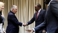 Kenya's President Uhuru Kenyatta (R) greets U.S. Secretary of State Rex Tillerson and his delegation prior to a meeting at the State House in Nairobi, on March 9, 2018. AFP / X90178 / Jonathan Ernst

