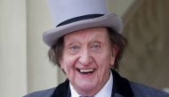 (FILES) In this file photo taken on March 2, 2017 British veteran entertainer Ken Dodd arrives for an investiture ceremony at Buckingham Palace. AFP / POOL / Yui Mok