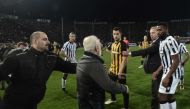 Paok president Ivan Savvidis (C) takes to the pitch carrying a handgun in his waistband (below C), after the referee refused a last minute goal on March 11, 2018 during the Greek Superleague football match PAOK Thessaloniki vs AEK Athens on March 11, 2018