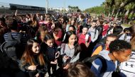 Students march from Westglades Middle School to a nearby park with students from Marjory Stoneman Douglas High School as part of a National School Walkout to honor the 17 students and staff members killed at the school in Parkland, Florida, U.S., March 14