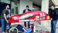 Students prepare to try their electric car prototype called Pyrforos at the Polytechnic School of Athens campus on March 6, 2018. AFP / Louisa Gouliamaki