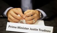 Canada's Prime Minister Justin Trudeau sits behind his name card at a round table discussion with steel industry leaders in Hamilton, Ontario, Canada, March 13, 2018. REUTERS/Mark Blinch
