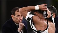 Juventus' Italian coach Massimiliano Allegri (rear C) argues with Juventus' Moroccan defender Mehdi Amine Benatia (front C) after his t-shirt was ripped-up by Atalanta's Dutch midfielder Marten de Roon (unseen) during the Italian Serie A football match be