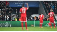 A cat runs on the pitch during the second leg of the last 16 UEFA Champions League football match between Besiktas and Bayern Munich at Besiktas Park in Istanbul on March 14, 2018. / AFP / Bulent Kilic
