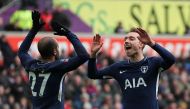 Tottenham Hotspur's Danish midfielder Christian Eriksen (R) celebrates scoring their third goal with Tottenham Hotspur's Brazilian midfielder Lucas Moura (L) during the English FA Cup quarter-final football match between Swansea City and Tottenham Hotspur