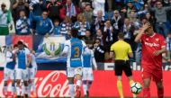 Sevilla's French forward Wissam Ben Yedder (R) reacts after Leganes' players scored their second goal during the Spanish League football match between Club Deportivo Leganes SAD and Sevilla FC at the Estadio Municipal Butarque in Leganes on March 18, 2018