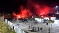 Lyon's fans use red flares before the Europa League football match Olympique Lyonnais (OM) vs CSKA Moscow on March 15, 2018, at the Groupama Stadium in Decines-Charpieu, central-eastern France. / AFP / ROMAIN LAFABREGUE
