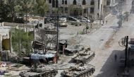 Syrian pro-government forces enter the main square of Kfar Batna, southeastern Ghouta, on the outskirts of the capital Damascus, on March 19, 2018. AFP 

