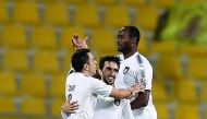 Al Sadd skipper Xavi Hernandez (left) celebrates with team-mates after scoring a goal during a QNB Stars League match in this file photo.