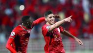 Al Duhail’s Karim Boudiaf (right) celebrates after scoring  during a QNB Stars League match in this file photo.