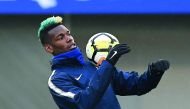 France's midfielder Paul Pogba controls the ball during a training session in Clairefontaine-en-Yvelines, southwest of Paris, on March 19, 2018, as part of the team's preparation for the friendly football matches against Colombia and Russia.  AFP / Franck