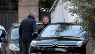 Former French President Nicolas Sarkozy enters his car as he leaves his house in Paris, France, March 21, 2018. REUTERS/Benoit Tessier