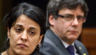 Swiss exiled pro-independence former member of the Catalan parliament Anna Gabriel (L) and pro-independence Catalonia's deposed leader Carles Puigdemont (R) attend a side event of the United Nations Human Rights Council on March 19, 2018 in Geneva.  AFP /
