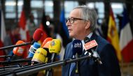 European Commission President Jean-Claude Juncker speaks to the press as he arrives on the first day of a summit of European Union (EU) leaders at the EU headquarters in Brussels, on March 22, 2018. / AFP / JOHN THYS