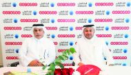 Officials of Ooredoo and Ahlibank at the agreement signing ceremony. 