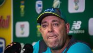 Darren Lehmann speaks to the press as he announces he will resign as Australian cricket coach after the coming Test match on March 29, 2018 in Johannesburg. / AFP / WIKUS DE WET