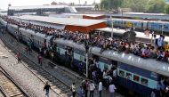 FILE PHOTO: Passengers board an overcrowded train at a railway station in Ajmer, India, October 23, 2016. REUTERS/Himanshu Sharma

