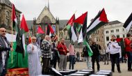 Model coffins, that the names of the 15 Palestinians, who were martyred in Gaza Strip are written, are seen during a demonstration at Dam Square as part of the Palestine's ‘Land Day’ in Amsterdam, Netherlands on March 31, 2018. (Abdullah A??ran - Anadolu 