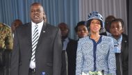 Botswana's vice-president and upcoming President Mokgweetsi Masisi (L) and his wife Neo Masisi arrive for a farawell ceremony for Botswana's President in his village Serowe on March 27, 2018, before he officially steps down on March 31 and hands power to 