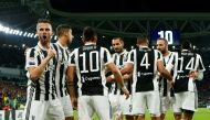 Juventus' Paulo Dybala celebrates with team mates after scoring their first goal REUTERS/Alessandro Garofalo
