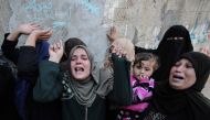 Palestinian women mourn in Khan Yunis, in the southern Gaza Strip on April 2, 2018 during the funeral of Faris al-Raqib, who died from his injuries after being shot in the stomach by Israeli forces a few days earlier.  AFP / Said Khatib
