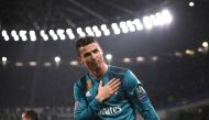 Real Madrid's Portuguese forward Cristiano Ronaldo celebrates his second goal during the UEFA Champions League quarter-final first leg football match between Juventus and Real Madrid at the Allianz Stadium in Turin on April 3, 2018. / AFP / Marco BERTOREL