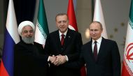 Presidents Hassan Rouhani of Iran, Tayyip Erdogan of Turkey and Vladimir Putin of Russia pose before their meeting in Ankara, Turkey April 4, 2018. Tolga Bozoglu/Reuters

