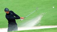 Tiger Woods of the U.S. hits from a sand trap on the second hole during first round play of the 2018 Masters golf tournament at the Augusta National Golf Club in Augusta, Georgia, April 5, 2018. Reuters/Mike Segar