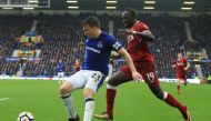 Everton's Irish defender Seamus Coleman (L) vies with Liverpool's Senegalese midfielder Sadio Mane during the English Premier League football match between Everton and Liverpool at Goodison Park in Liverpool, north west England on April 7, 2018.   AFP / L