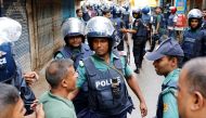 FILE PHOTO: Police keep the public away near the site of a police operation on the outskirts of Dhaka, Bangladesh, July 26, 2016. Reuters/ Mohammad Ponir Hossain