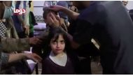 A girl looks on following alleged chemical weapons attack, in what is said to be Douma, Syria on April 8, 2018.