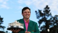 Patrick Reed of the United States celebrates with the trophy during the green jacket ceremony after winning the 2018 Masters Tournament at Augusta National Golf Club on April 8, 2018 in Augusta, Georgia. (Andrew Redington/Getty Images/AFP)
