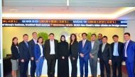 Sheikha Alanoud Hamad Al Thani (sixth left), Managing Director, Business Development, QFC Authority and other QFC officials with the vising business delegation from Singapore at QFC premises, yesterday. ? See also page 18