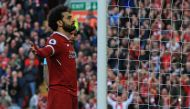 Liverpool's Egyptian midfielder Mohamed Salah celebrates after scoring their second goal during the English Premier League football match between Liverpool and Bournemouth at Anfield in Liverpool, north west England on April 14, 2018.  AFP / Lindsey PARNA
