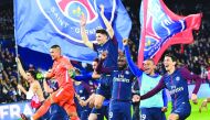 aris Saint-Germain's players celebrate after winning the French L1 football match between Paris Saint-Germain (PSG) and Monaco (ASM) on April 15, 2018, at the Parc des Princes stadium in Paris.  AFP / Christophe Archambault