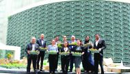 The Holiday Villa team holding the planters during the installation of vertical gardens.