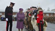 FILE PHOTO: Queen Elizabeth reviews members of The Royal Welsh Regimental Family and one of two regimental goats at Lucknow Barracks during a visit to mark St David's Day in Tidworth, March 3, 2017. (Reuters / Ben Birchall) 