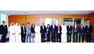 The QSE officials with the visiting delegation from Shenzhen Stock Exchange and China Merchant Securities, yesterday.