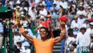 Spain's Rafael Nadal celebrates after his victory against Bulgaria's Grigor Dimitrov during their semi-final match at the Monte-Carlo ATP Masters Series tournament on April 21, 2018 in Monaco. / AFP / YANN COATSALIOU