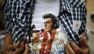 An Elvis Presley fan shows his T-shirt at the four-day Collingwood Elvis Festival in Collingwood, Ontario July 25, 2015. Reuters/Chris Helgren

