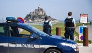 French gendarmes block the road leading to the Mont-Saint-Michel after it was evacuated on April 22, 2018 of its tourists and residents 