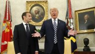 French President Emmanuel Macron (L) looks on as U.S. President Donald Trump speaks during their meeting in the Oval Office following the official arrival ceremony for Macron at the White House in Washington, U.S., April 24, 2018. REUTERS/Kevin Lamarque
