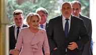 Romanian Prime Minister Viorica Dancila (L) welcomes Bulgarian Prime Minister, Boiko Borisov as he arrives at the Victoria Palace, the Romanian Government headquarters, for a high-level quadrilateral meeting of Romania, Bulgaria, Serbia and Greece on Apri