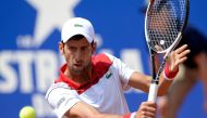 Serbia's Novak Djokovic returns the ball to Slovakia's Martin Klizan during their Barcelona Open ATP tournament tennis match in Barcelona on April 25, 2018. / AFP / Josep LAGO
