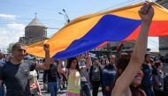 Armenian opposition supporters march in Yerevan on April 26, 2018. / AFP / KAREN MINASYAN
