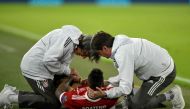 Bayern Munich's German defender Jerome Boateng receives medical care after being injured during the UEFA Champions League semi-final first-leg football match FC Bayern Munich v Real Madrid CF in Munich, southern Germany on April 25, 2018. / AFP / GUENTER 