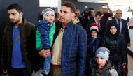 Unidentified people from Douma, Syria, arrive at a news conference in the Hague, Netherlands, April 26, 2018. Reuters/Michael Kooren