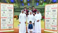 The podium winners of the Big Tour pose for a photograph with officials after the presentation ceremony at the Al Shaqab’s main arena yesterday.